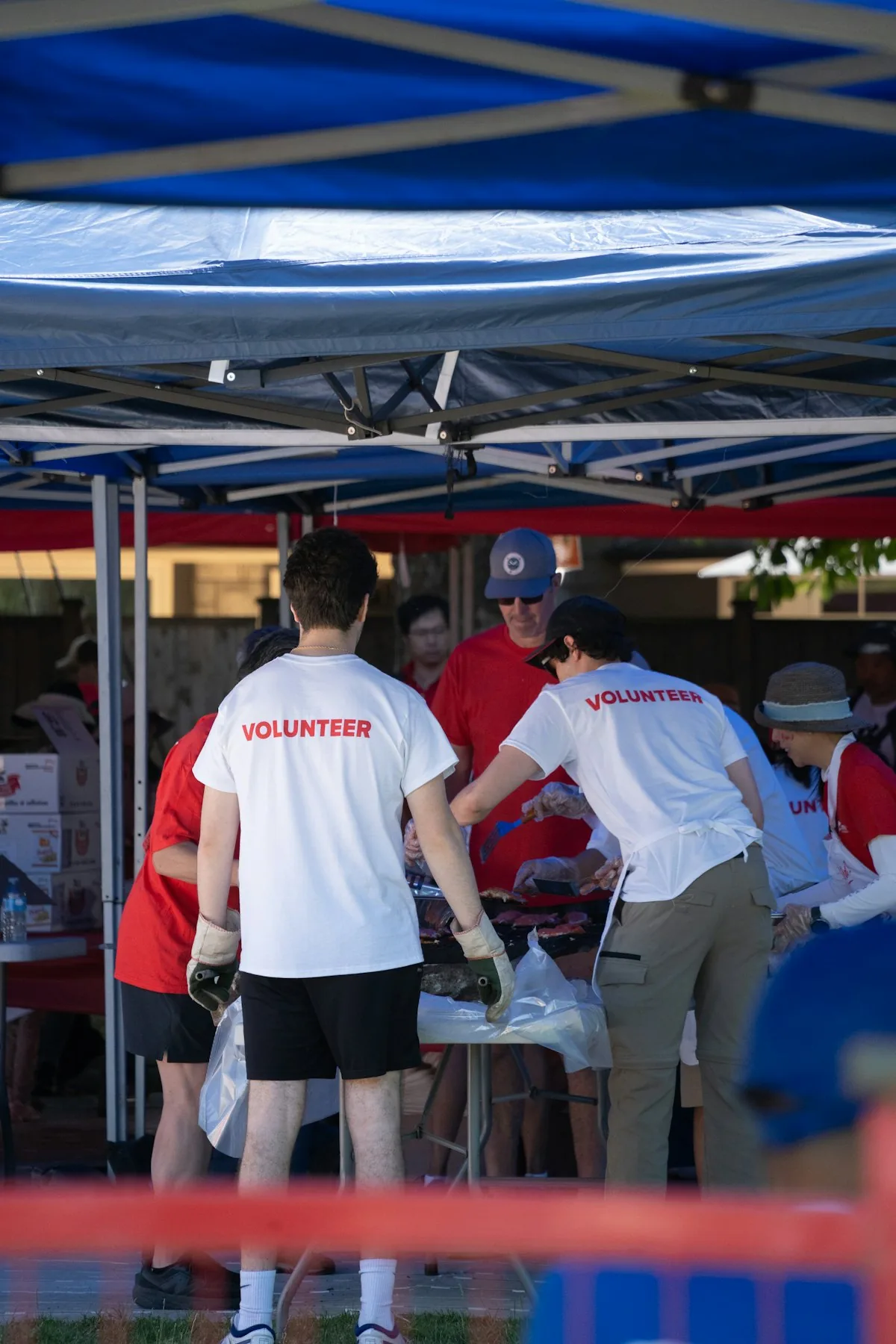 Volunteers organising supplies at an outdoor community event